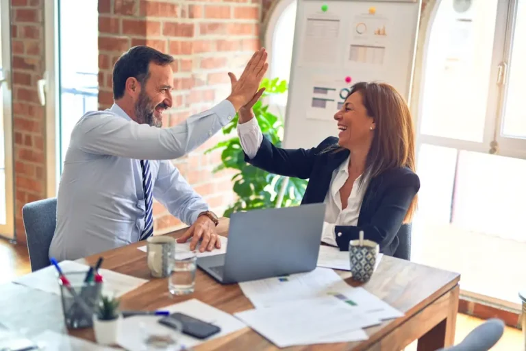 Business team celebrating a success in the office